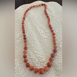 Polished agate hand tied beads necklace 26 inches lengyh.